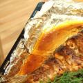 Carp with potatoes, baked whole in the oven