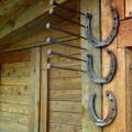 What to hang above the door.  We hang a horseshoe in the house.  How to increase the protective powers of a horseshoe